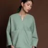 KAAREMArctic Long Sleeve Slit Pocket Top - Light Sage Green